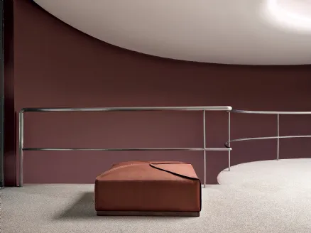 Square Helix pouf in leather with solid wood base by Frigerio.