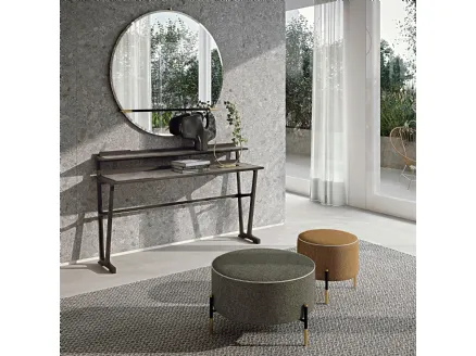 Pouf Kevin in fabric upholstery with a lightweight metal base and contrasting details by Frigerio.