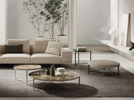 Round Santamonica coffee table with glass top and tubular metal base painted by Frigerio.
