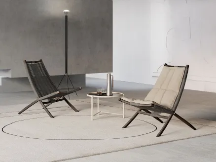 Huli armchair in synthetic fiber covered in padded fabric with solid wood structure by Frigerio.