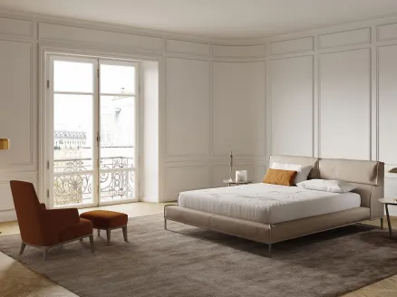 Soft and enveloping leather bed with Frigerio Cloud headboard.