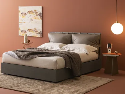 Bed with Dual Legno storage box and Oggioni leather headboard.