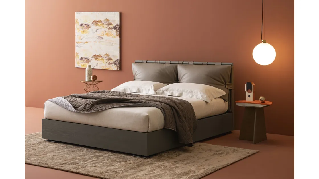 Bed with Dual Legno storage box and Oggioni leather headboard.