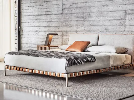 Gregory bed with fabric headboard and aluminum feet by Flexform