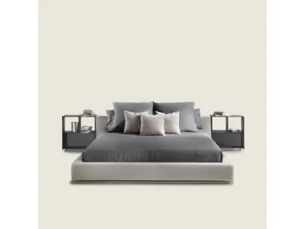 Elegant bed with essential design in Flexform's Groundpiece fabric.