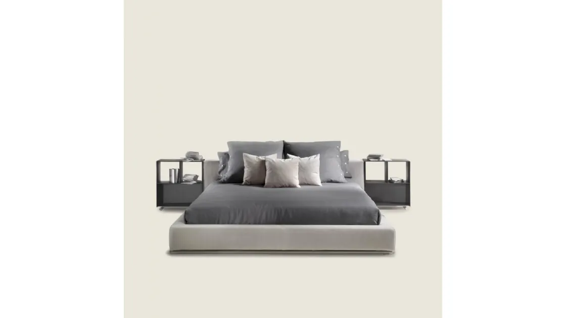 Elegant bed with essential design in Flexform's Groundpiece fabric.