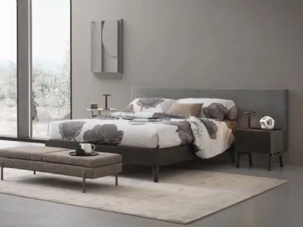 Kelly wooden bed with Oggioni fabric headboard.