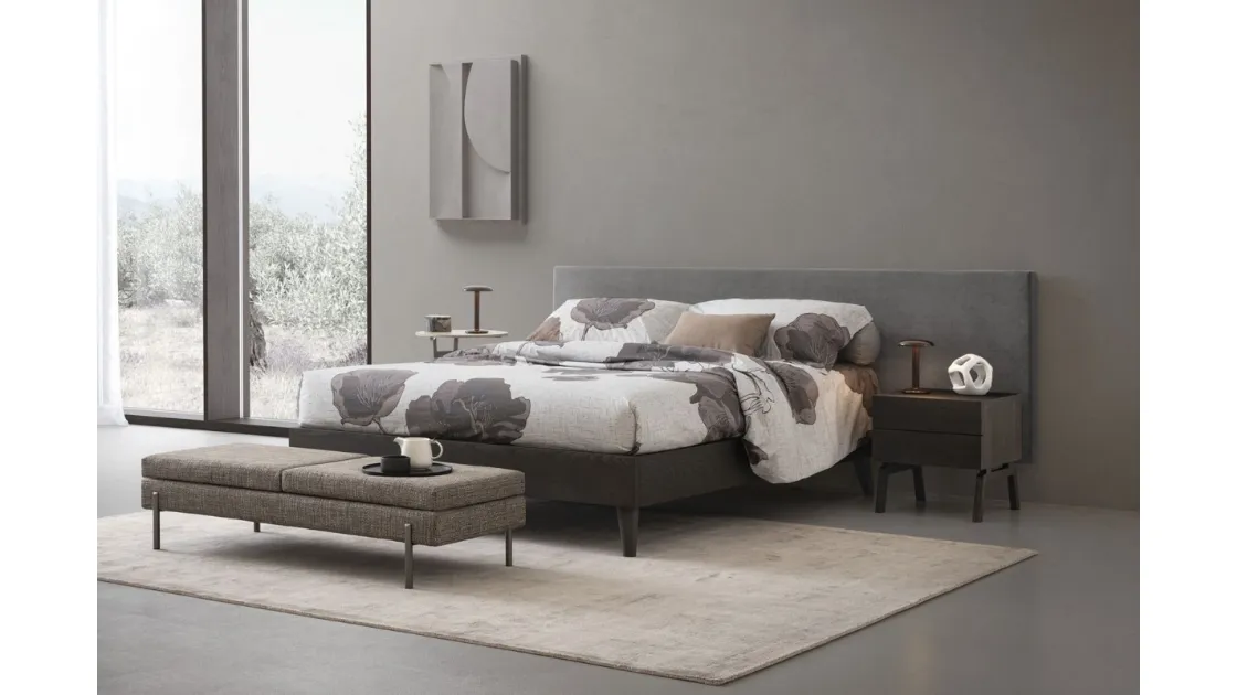 Kelly wooden bed with Oggioni fabric headboard.