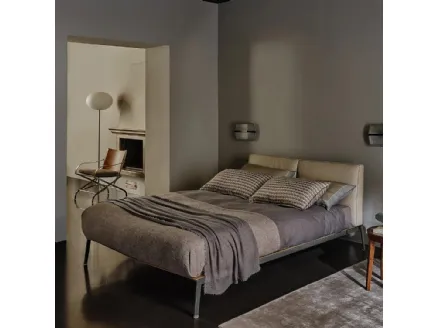 Bed with Lifesteel leather headboard by Flexform.