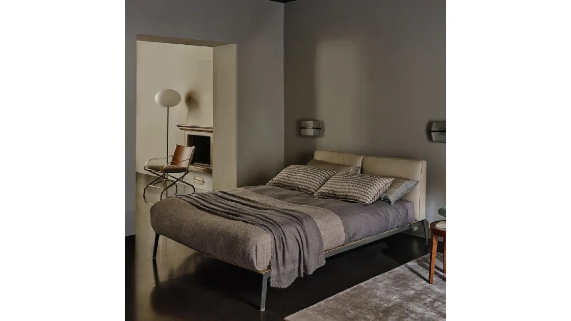Bed with Lifesteel leather headboard by Flexform.