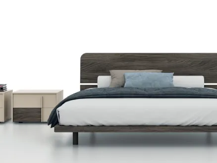 Double bed with Maggi headboard by Tagliabue Mobili.
