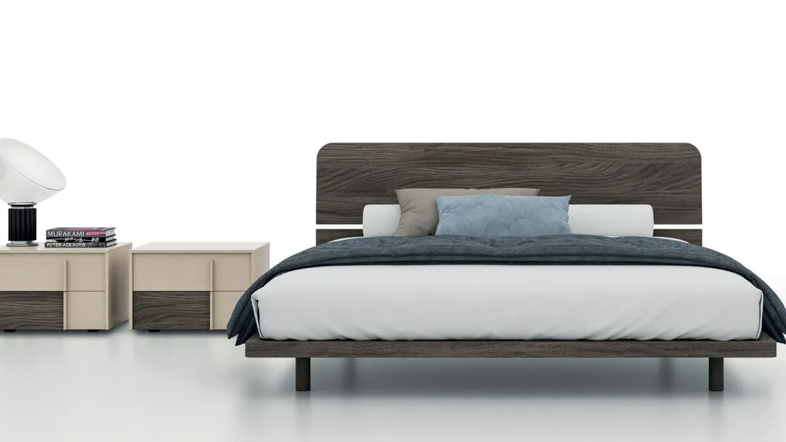 Double bed with Maggi headboard by Tagliabue Mobili.