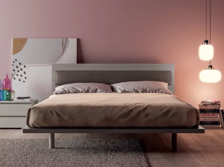 Double bed with wooden effect headboard with Olimpia eco-leather insert by Tagliabue Mobili.