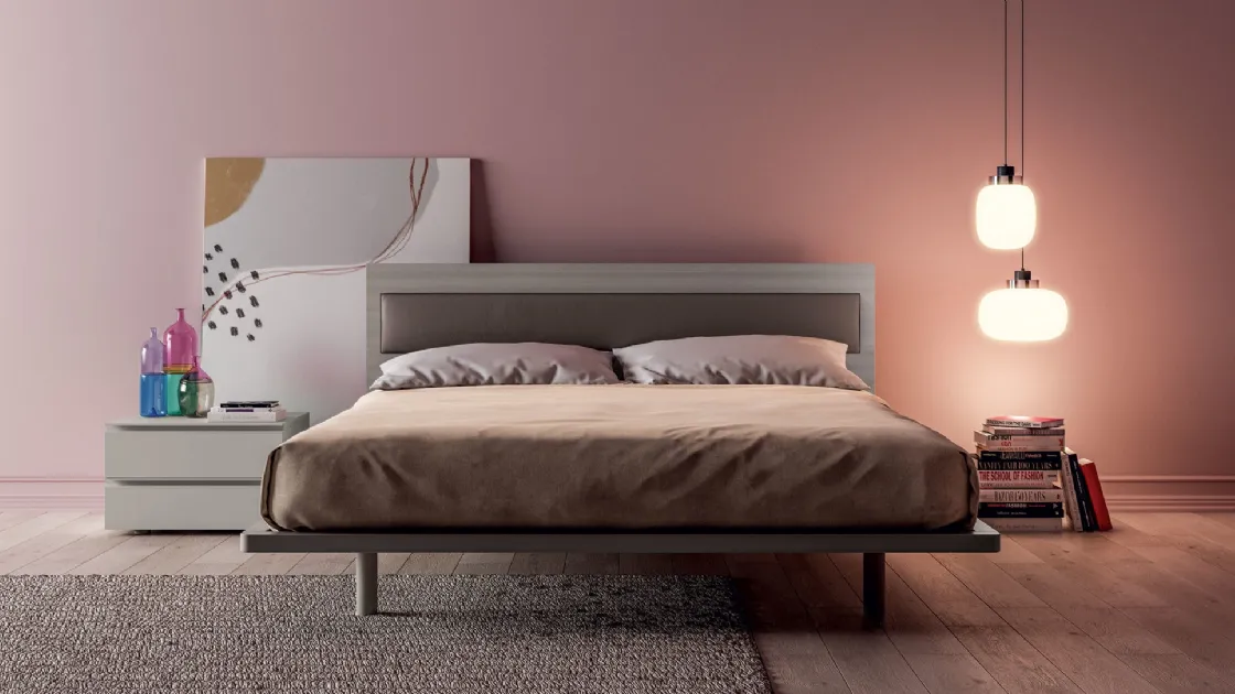 Double bed with wooden effect headboard with Olimpia eco-leather insert by Tagliabue Mobili.