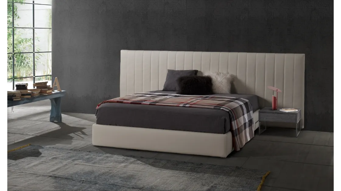 Fabric bed with vertically quilted headboard Roddy by Excò.