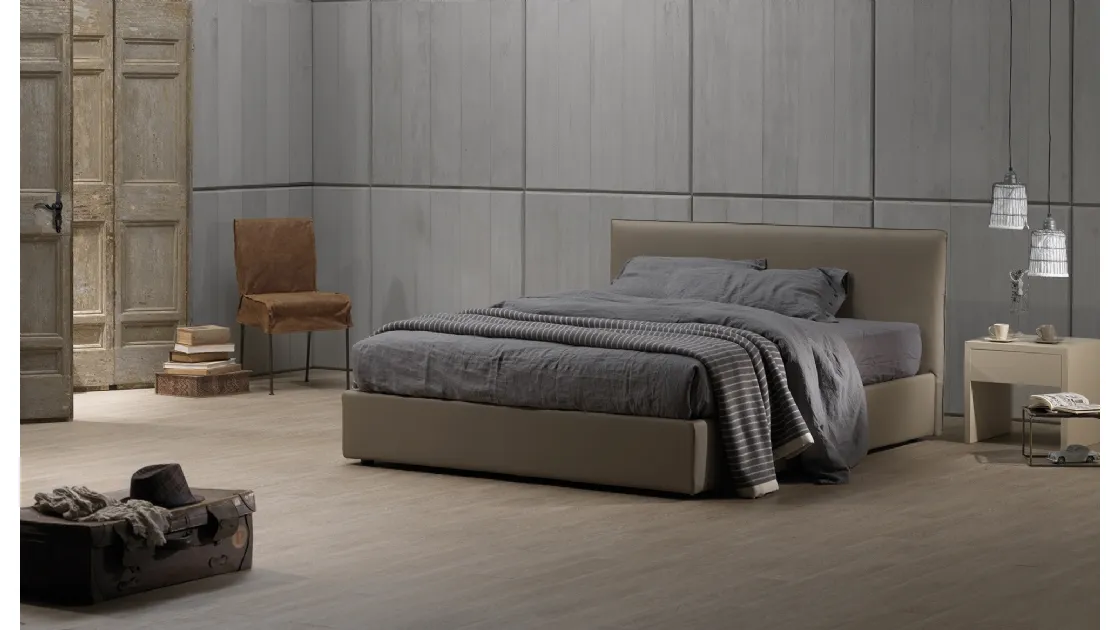 Double bed in faux leather Zizuzi 28 with storage box and headboard by Excò.