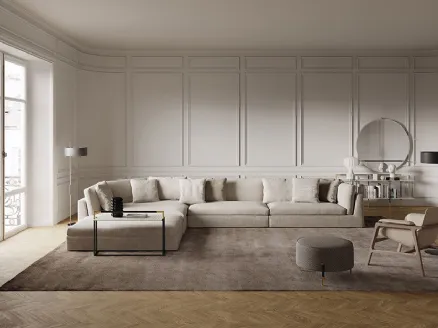 Modular corner sofa with light Arnè fabric upholstery by Frigerio.