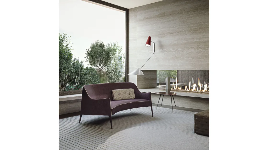 Two-seater Jackie Bergere sofa with a semi-curved shape, molded arms, high backrest in fabric, and solid wood legs by Frigerio.