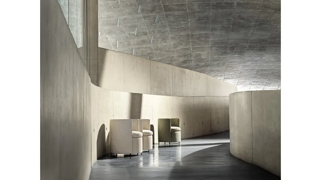 Lou chair upholstered in fabric by Frigerio