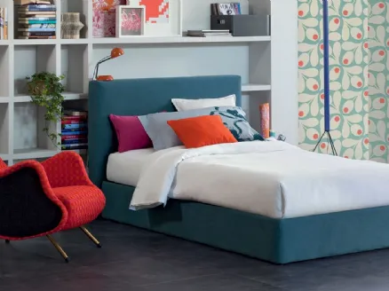 Single bed in fabric with Eclipse headboard by Oggioni.