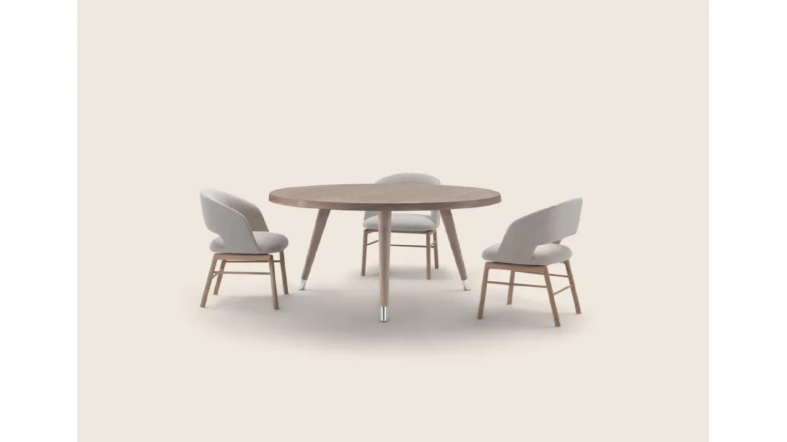 Round wooden Adler table by Flexform.