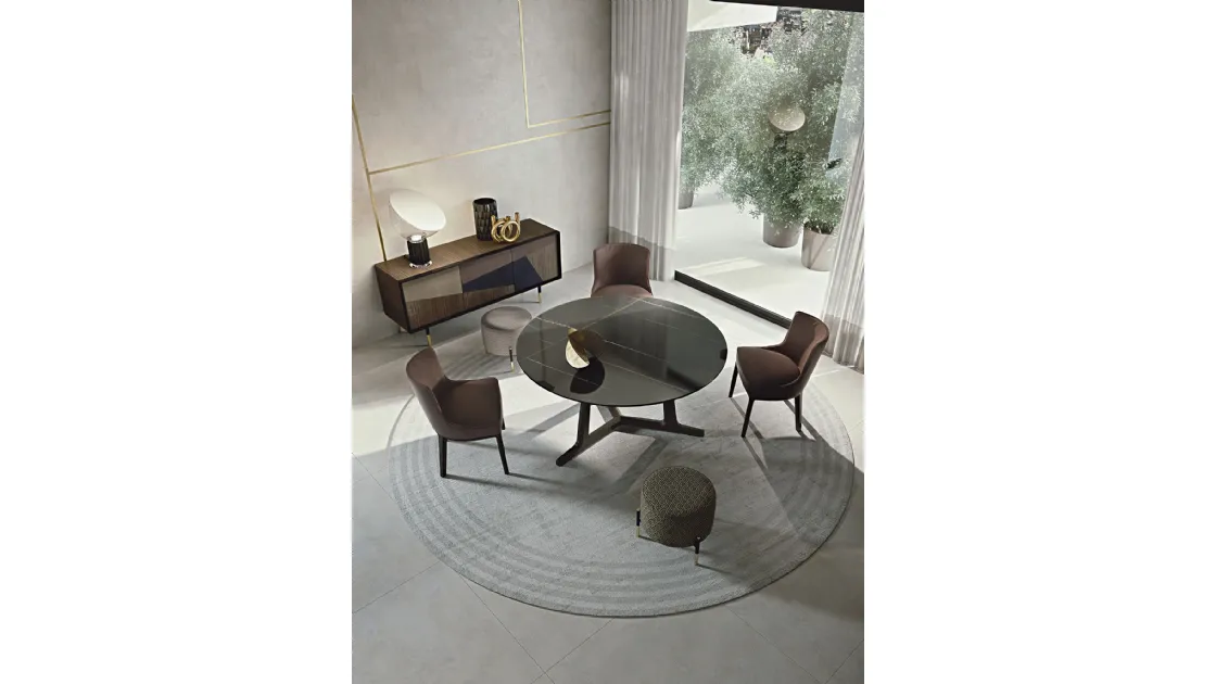 Round porcelain stoneware table with marble effect, with Arja solid wood base by Frigerio.