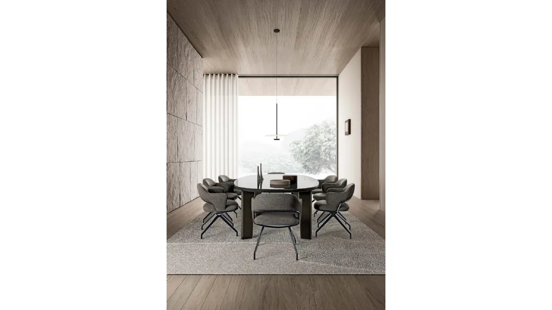 Arnold table with glass top and wooden structure by Flexform.