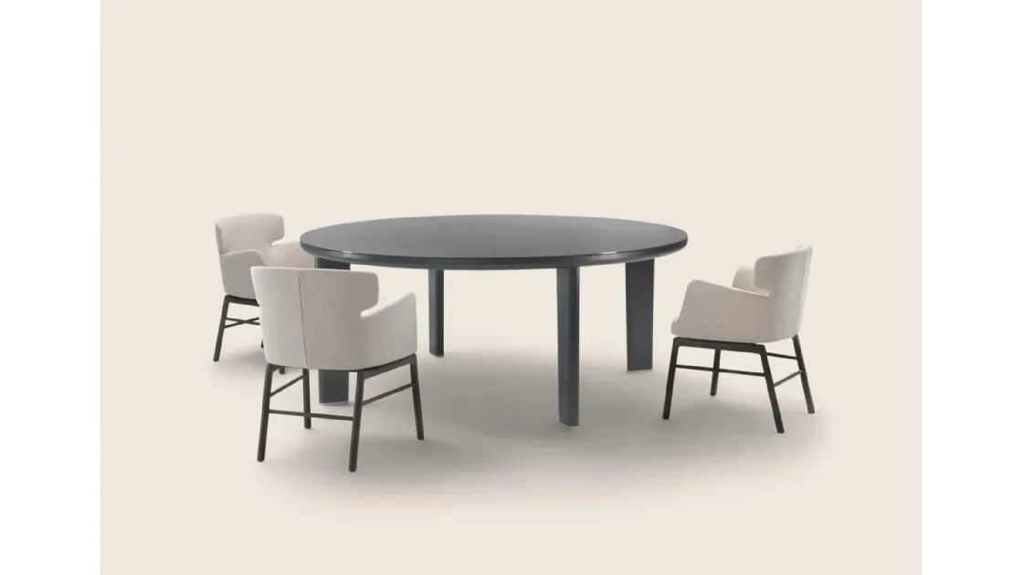Arnold table with glass top and wooden structure by Flexform.