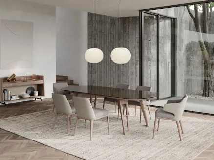 Axel table in smoked glass texture and legs in solid wood by Frigerio.