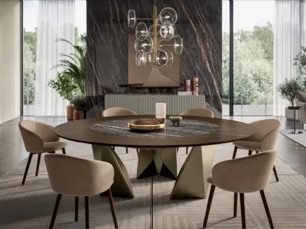 Round wooden table with SuperMarmo Kaleido by Bontempi.