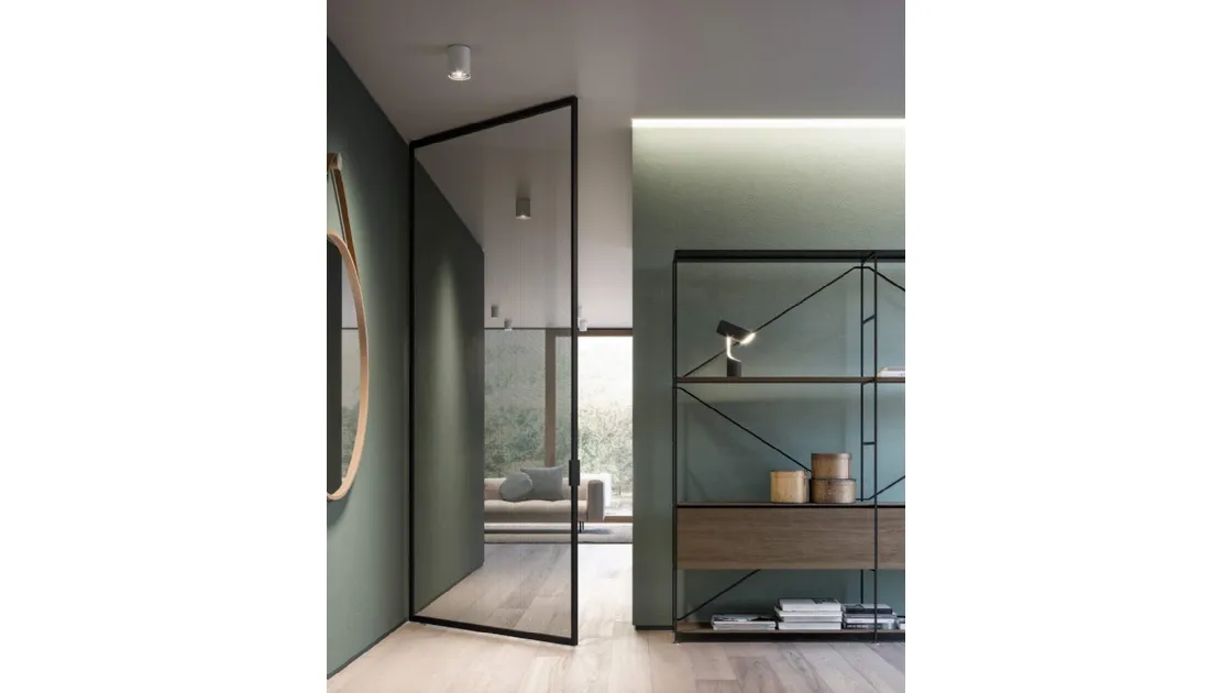 Legendary interior door Bilico opening in glass with aluminum frame by ADL.