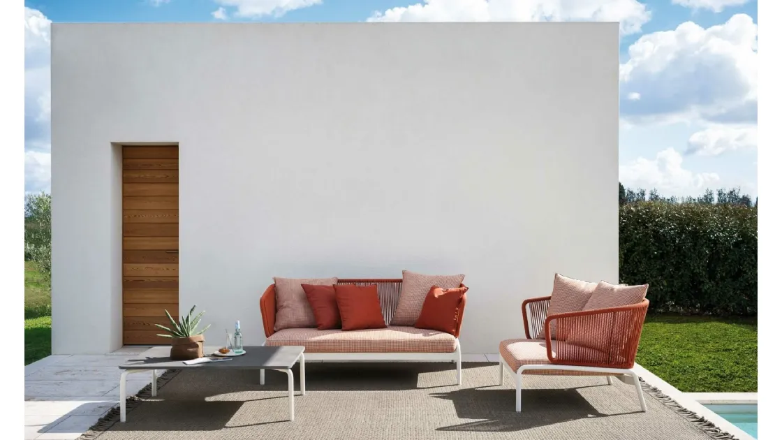 Outdoor furniture in fabric with stone Spool table by Roda.